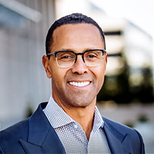 a headshot of a professional financial advisor smiling